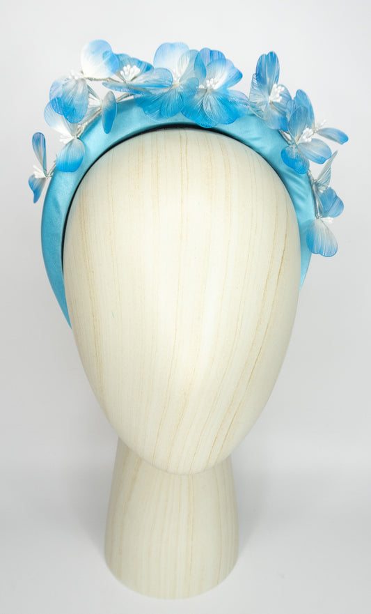 Baby blue satin padded headband with flower detail