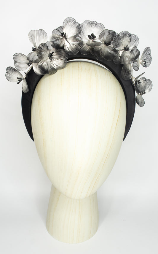 Black padded headband with flower detail